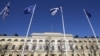 NATO and Finland flags flutter over the building of Ministry of Internal Affairs in Helsinki, Finland, Tuesday, April 4, 2023. (AP Photo/Sergei Grits)