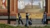 Ukraine -- Children play in front of a church at the memorial for victims of the Chornobyl nuclear disaster in Kyiv, April 26, 2015